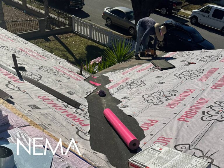 Underlayment and new roofing materials on a sloped roof during a roof replacement