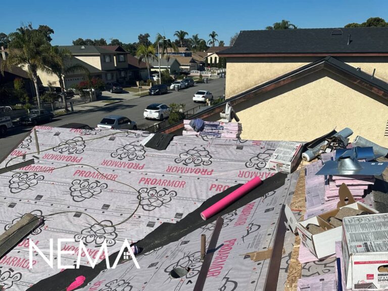 Shingle roof replacement in progress, underlayment on the roof deck
