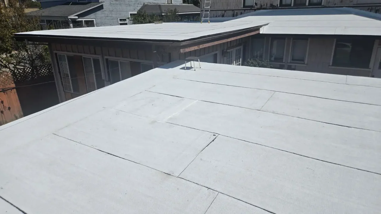 Light-coloured low-slope roof finished by NEMA Roofing
