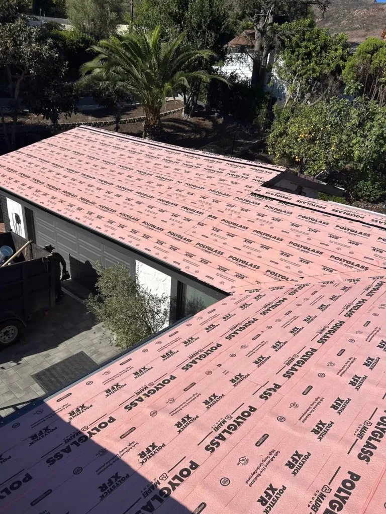 New roof underlayment going down during a NEMA Roofing reroof